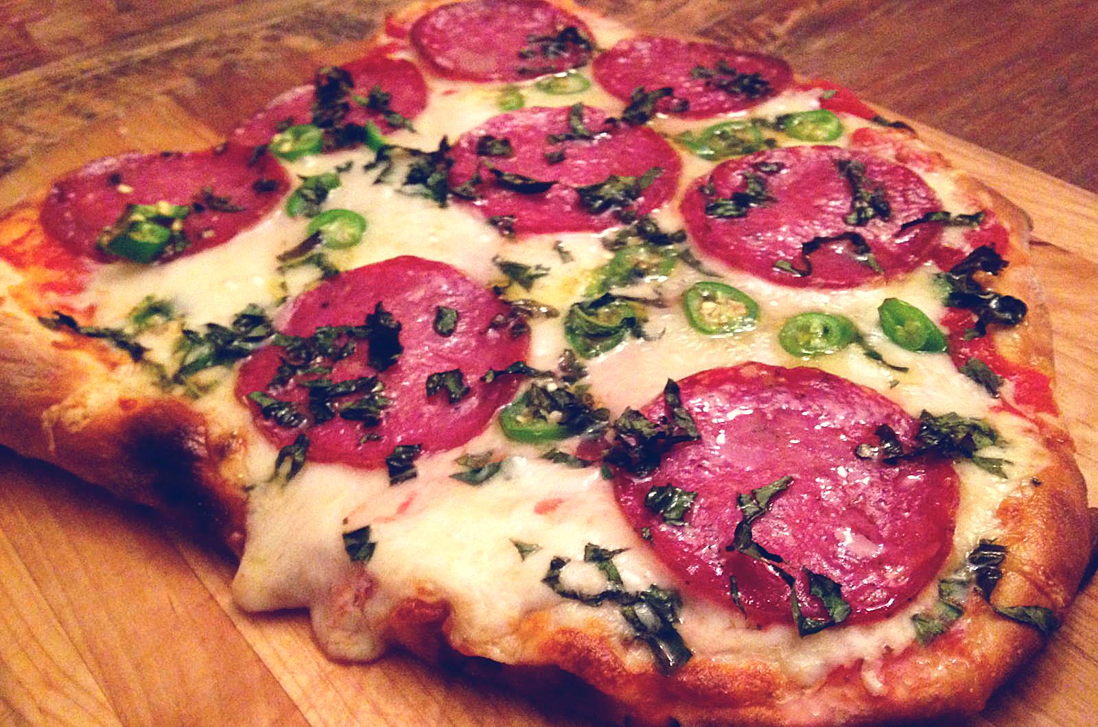 Soppressata, Fontina, And Mozzarella, Pizza with Basil, Chilies, and